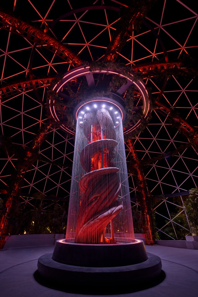 Illuminated fountain inside a geodesic dome.
