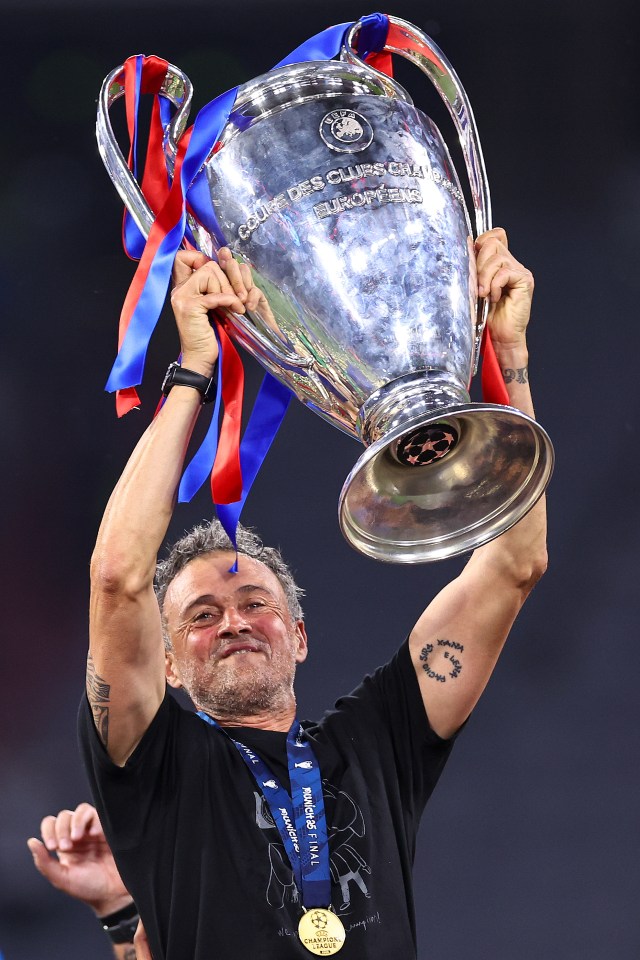 Luis Enrique lifting the UEFA Champions League trophy.