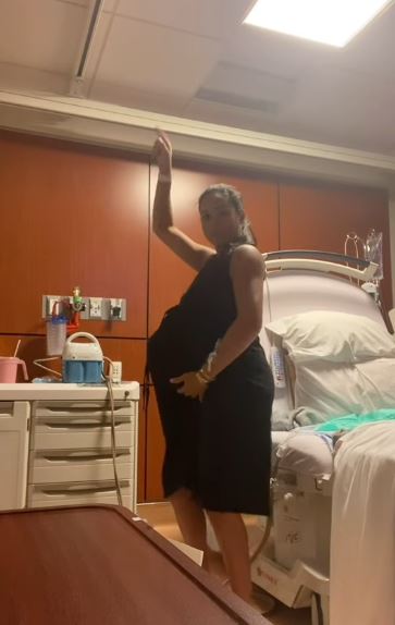 Pregnant woman in hospital room.