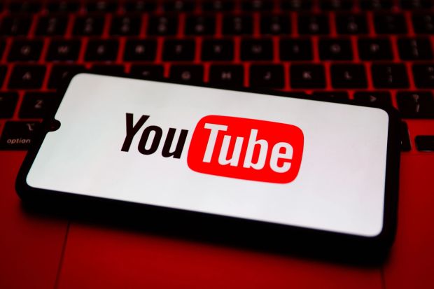 An image collage containing 1 images, Image 1 shows YouTube logo on a phone screen