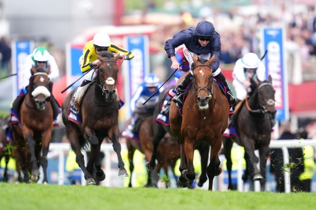 Horses racing in the Betfred Derby.